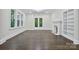 Bright living room boasts hardwood floors, fireplace, and access to the outdoors at 1783 Radio Station Rd, Newton, NC 28658