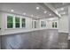 Bright and open living room features hardwood floors and multiple windows providing natural light at 1783 Radio Station Rd, Newton, NC 28658