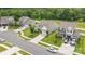 Aerial view of a suburban street showcasing beautiful homes with manicured lawns at 196 Sutters Mill Dr, Troutman, NC 28166