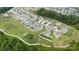 Scenic aerial view of a neighborhood with lush green spaces and walking trails at 196 Sutters Mill Dr, Troutman, NC 28166