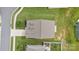 Birds eye view of a house and lawn with a pond and surrounding neighborhood at 196 Sutters Mill Dr, Troutman, NC 28166