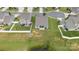 Aerial view showcasing backyard with a screened patio overlooking the pond at 196 Sutters Mill Dr, Troutman, NC 28166