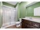 Bathroom featuring shower with glass door, vanity with sink, and modern fixtures at 196 Sutters Mill Dr, Troutman, NC 28166