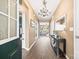 Elegant entryway with hardwood floors, chandelier, and console table at 196 Sutters Mill Dr, Troutman, NC 28166