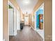 Elegant entryway with hardwood floors, chandelier, and console table at 196 Sutters Mill Dr, Troutman, NC 28166