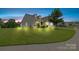 Charming two-story home boasts a manicured lawn and stone accents at 196 Sutters Mill Dr, Troutman, NC 28166