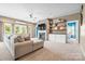 Comfortable living room with stone fireplace, built-in shelves, and neutral color scheme at 196 Sutters Mill Dr, Troutman, NC 28166