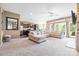 Inviting living room with plush sectional sofa, fireplace, and open layout to the kitchen at 196 Sutters Mill Dr, Troutman, NC 28166