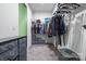 Organized walk-in closet featuring shelving, hanging racks, and drawer units for efficient storage at 196 Sutters Mill Dr, Troutman, NC 28166