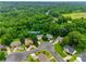 An aerial view showcases the property nestled in lush greenery with a cul-de-sac street and well-maintained landscaping at 2132 Cubla Ct, Rock Hill, SC 29732