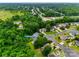 Aerial shot of a home in a neighborhood featuring mature trees, manicured lawns, and well-maintained residential streets at 2132 Cubla Ct, Rock Hill, SC 29732