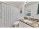 Bathroom features a granite countertop vanity with framed mirror and framed art at 2132 Cubla Ct, Rock Hill, SC 29732