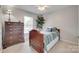 Bright bedroom with hardwood floors, large window, and a spacious closet at 2132 Cubla Ct, Rock Hill, SC 29732