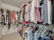This walk-in closet is full of clothing with ample storage at 2132 Cubla Ct, Rock Hill, SC 29732