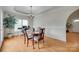 Elegant dining room with hardwood floors, a decorative chandelier, and ample natural light at 2132 Cubla Ct, Rock Hill, SC 29732