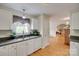 This bright kitchen has a window and flows into the living room at 2132 Cubla Ct, Rock Hill, SC 29732