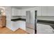 This kitchen features stainless steel appliances, granite countertops, and white cabinets at 2132 Cubla Ct, Rock Hill, SC 29732
