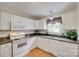 Bright kitchen features white cabinets, granite countertops, and stainless steel appliances at 2132 Cubla Ct, Rock Hill, SC 29732