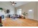 Bright and airy living room featuring vaulted ceilings, hardwood floors, and a cozy fireplace at 2132 Cubla Ct, Rock Hill, SC 29732