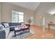 Cozy living room featuring hardwood floors, a comfortable couch, and a large window for natural light at 2132 Cubla Ct, Rock Hill, SC 29732