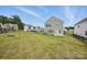 Spacious backyard featuring a well-maintained lawn and a black fence surrounding the property at 223 Haddonsfield Dr, Mooresville, NC 28115