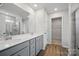 Bathroom with double sink vanity, frameless glass shower and access to walk-in closet at 223 Haddonsfield Dr, Mooresville, NC 28115