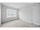 Cozy bedroom with carpet floor, a window and a door at 223 Haddonsfield Dr, Mooresville, NC 28115