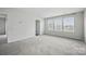 Spacious bedroom features three large windows allowing plenty of natural light at 223 Haddonsfield Dr, Mooresville, NC 28115