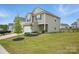Charming two-story home featuring a stone-accented facade, attached garage, and well-maintained landscaping at 223 Haddonsfield Dr, Mooresville, NC 28115