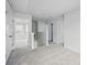 Hallway with carpeted floor, three doors and a staircase at 223 Haddonsfield Dr, Mooresville, NC 28115
