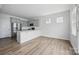 Modern kitchen with stainless steel appliances, gray cabinets, and white countertops at 223 Haddonsfield Dr, Mooresville, NC 28115