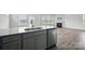 Close up of a sink, dishwasher, and cabinets in the modern kitchen area at 223 Haddonsfield Dr, Mooresville, NC 28115