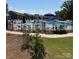 Community pool with a black metal fence and lounge chairs for neighborhood residents at 223 Haddonsfield Dr, Mooresville, NC 28115