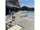 Community swimming pool, lounge chairs, and clubhouse for residents to enjoy at 223 Haddonsfield Dr, Mooresville, NC 28115