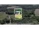Aerial view of the property, showing boundary lines, a pond, fields, and mature tree coverage at 2932 Rant Drum Rd, Maiden, NC 28650