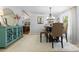 Inviting dining room showcases elegant furnishings, adjacent to a living space, creating a welcoming atmosphere at 2932 Rant Drum Rd, Maiden, NC 28650