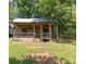 Charming log cabin with a welcoming porch, nestled in a tranquil, tree-filled setting at 2932 Rant Drum Rd, Maiden, NC 28650