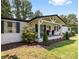 Quaint porch features classic rocking chairs and well-maintained landscaping at 2932 Rant Drum Rd, Maiden, NC 28650