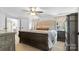 Serene main bedroom featuring a large bed, ample natural light, and access to an ensuite bathroom at 2932 Rant Drum Rd, Maiden, NC 28650