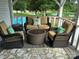 Inviting outdoor seating area with a fire pit and view of the refreshing pool and pond at 2932 Rant Drum Rd, Maiden, NC 28650