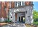 Elegant building entrance with stone archway and manicured landscaping exudes classic charm and curb appeal at 301 W 10Th St # 404, Charlotte, NC 28202