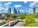 Breathtaking skyline view showcases the city's modern architecture from rooftop terrace surrounded by lush greenery at 301 W 10Th St # 404, Charlotte, NC 28202