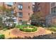 Charming courtyard featuring a decorative fountain, lush landscaping, and inviting seating areas at 301 W 10Th St # 404, Charlotte, NC 28202