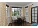 Bright dining area with large windows, modern decor, and a stylish table setting, ideal for entertaining guests at 301 W 10Th St # 404, Charlotte, NC 28202