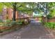 Gated entryway and paved drive of brick building at 301 W 10Th St # 404, Charlotte, NC 28202