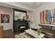 Comfortable living room featuring a fireplace, stylish art, and a leather sofa, perfect for relaxation at 301 W 10Th St # 404, Charlotte, NC 28202