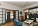 View of the living room showing open access to the kitchen and fireplace, with stylish decor throughout at 301 W 10Th St # 404, Charlotte, NC 28202