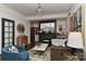 Stylish living room with elegant decor, a decorative fireplace with mirror, and comfortable seating at 301 W 10Th St # 404, Charlotte, NC 28202