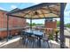 Outdoor dining on a partially covered rooftop deck area at 301 W 10Th St # 404, Charlotte, NC 28202