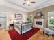 Charming bedroom features a fireplace, stylish decor, and access to a luxurious bathroom at 3394 Rainbow Dr, Waxhaw, NC 28173